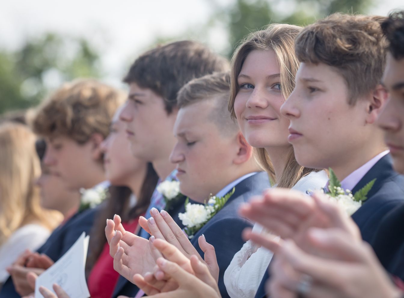 Pupils appluading outside